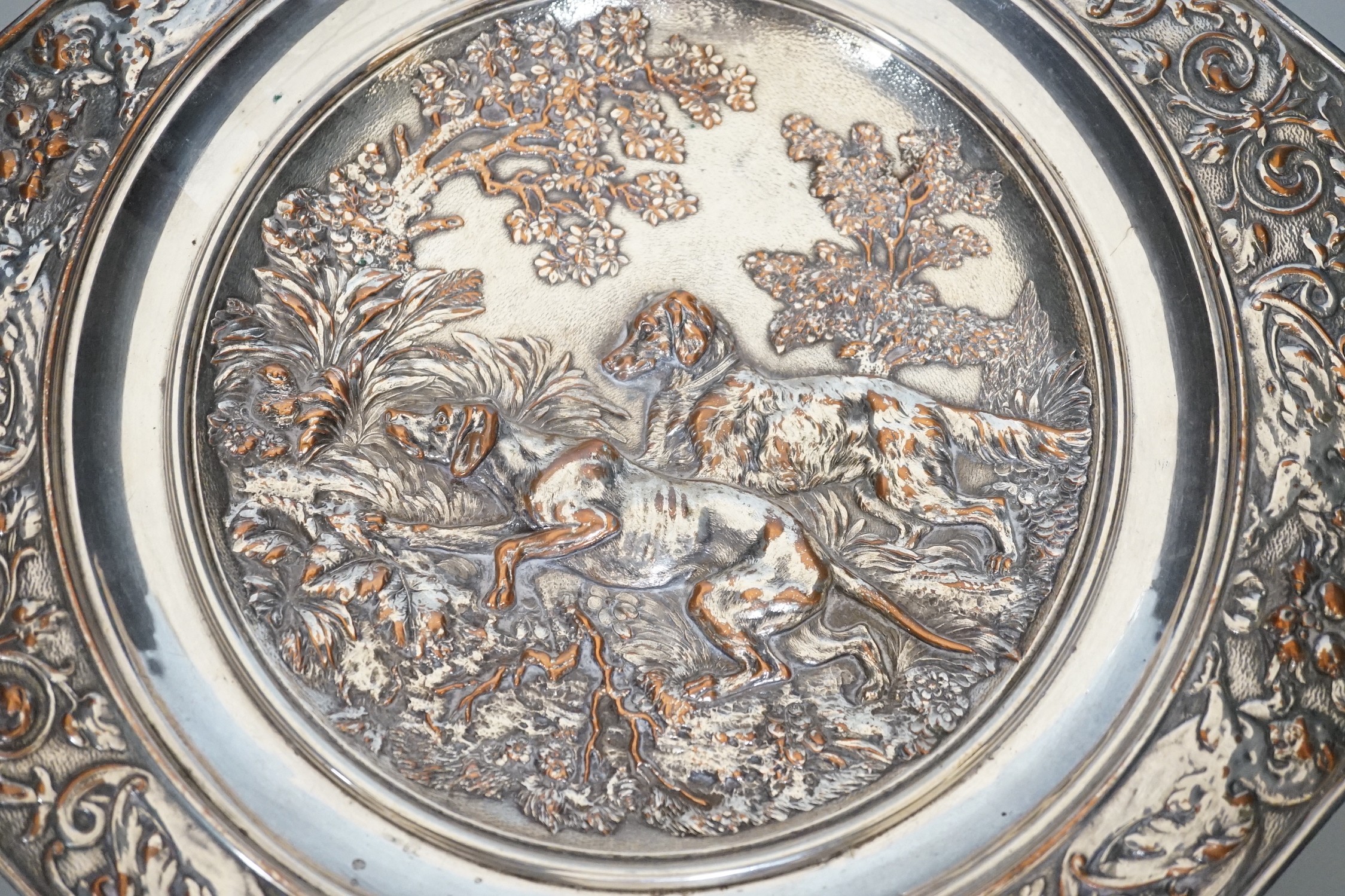 An early 20th century Elkington type silver plated tazza embossed with hunting dogs, 29cm